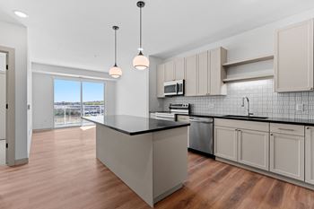 Large kitchen with an island and a large window